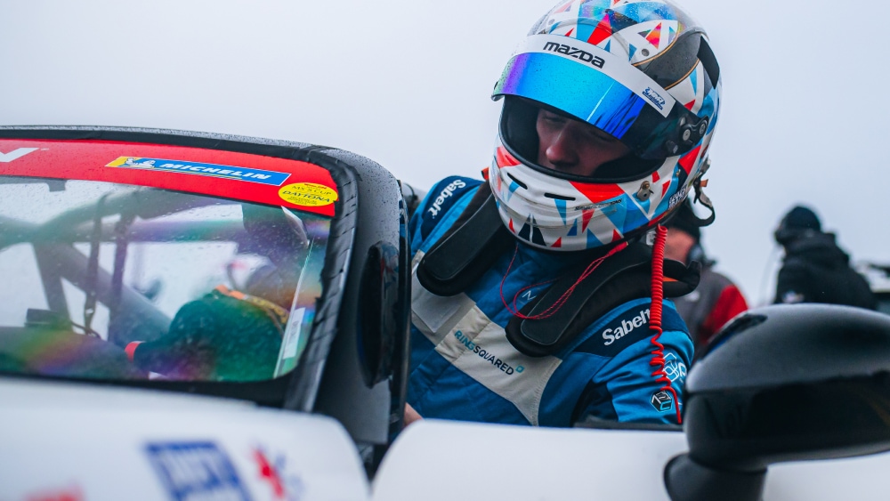 Driver Stepping Into a Mazda MX-5 Race Car