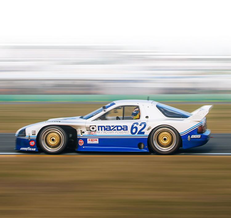 Mazda RX-7 GTO Driving on a Racetrack