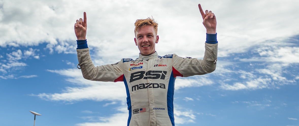 Mazda Racer With Fingers Up Signaling First