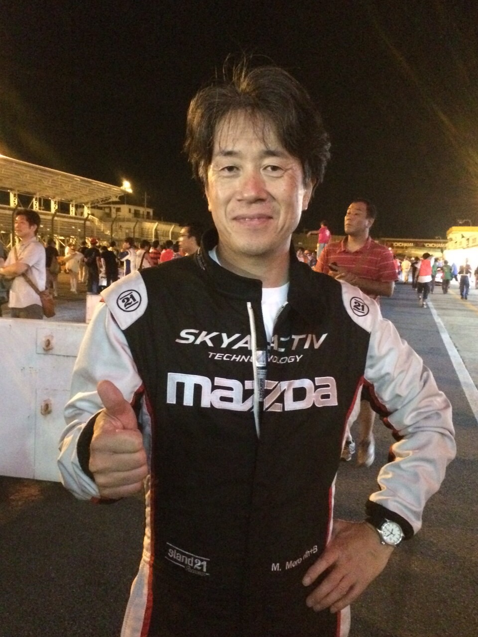 Masahiro Moro, Chairman and CEO of MNAO – in Racing Gear