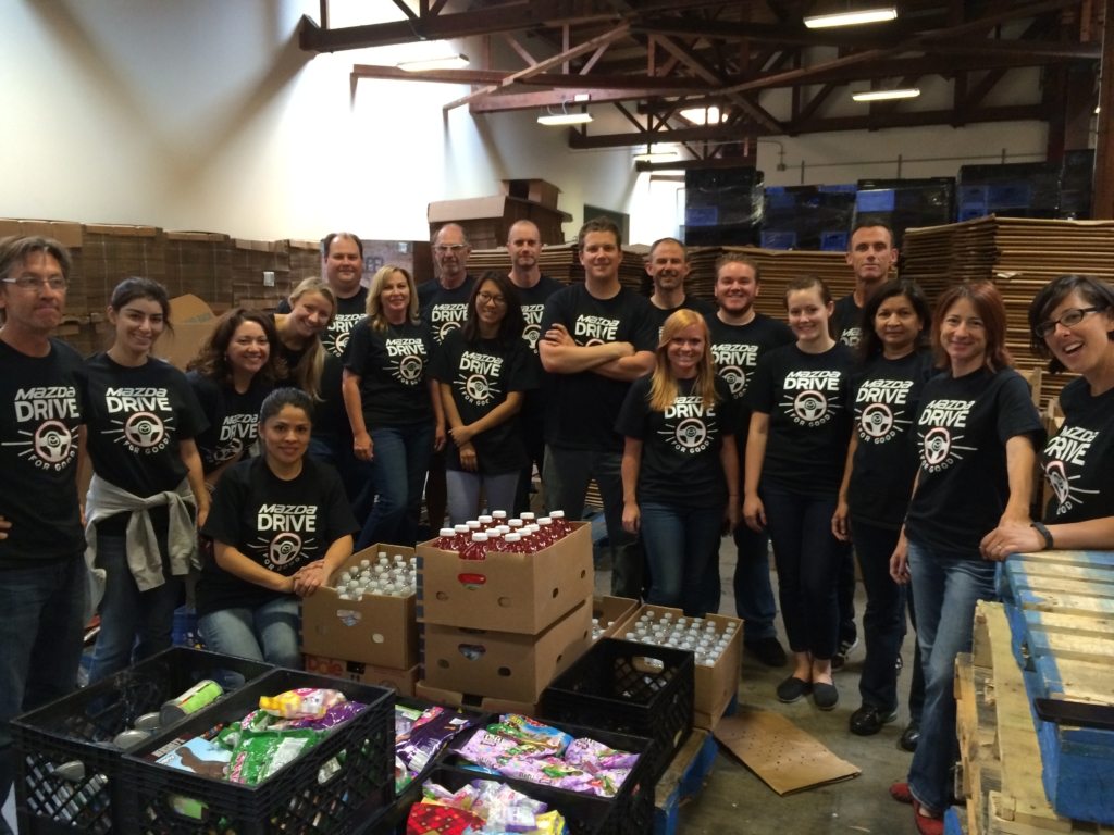 Mazda Drive for Good Community Project Volunteers with Packed Boxes