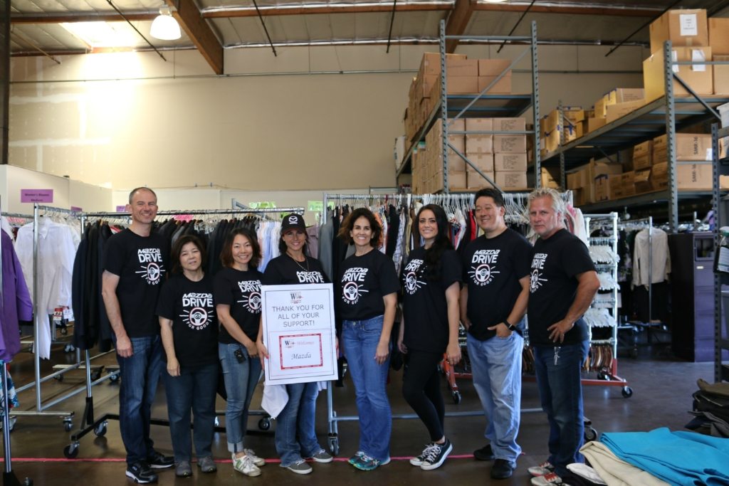 Mazda Drive for Good Community Project Volunteers in a Warehouse
