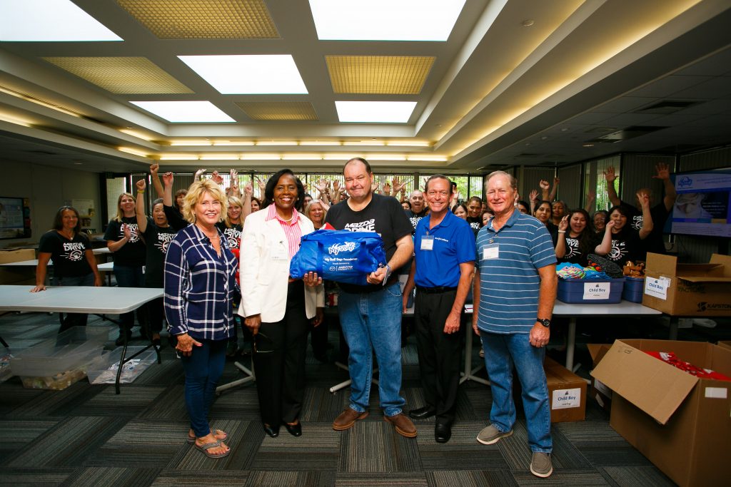 Mazda Foundation Volunteers Providing My Stuff Bags to Children