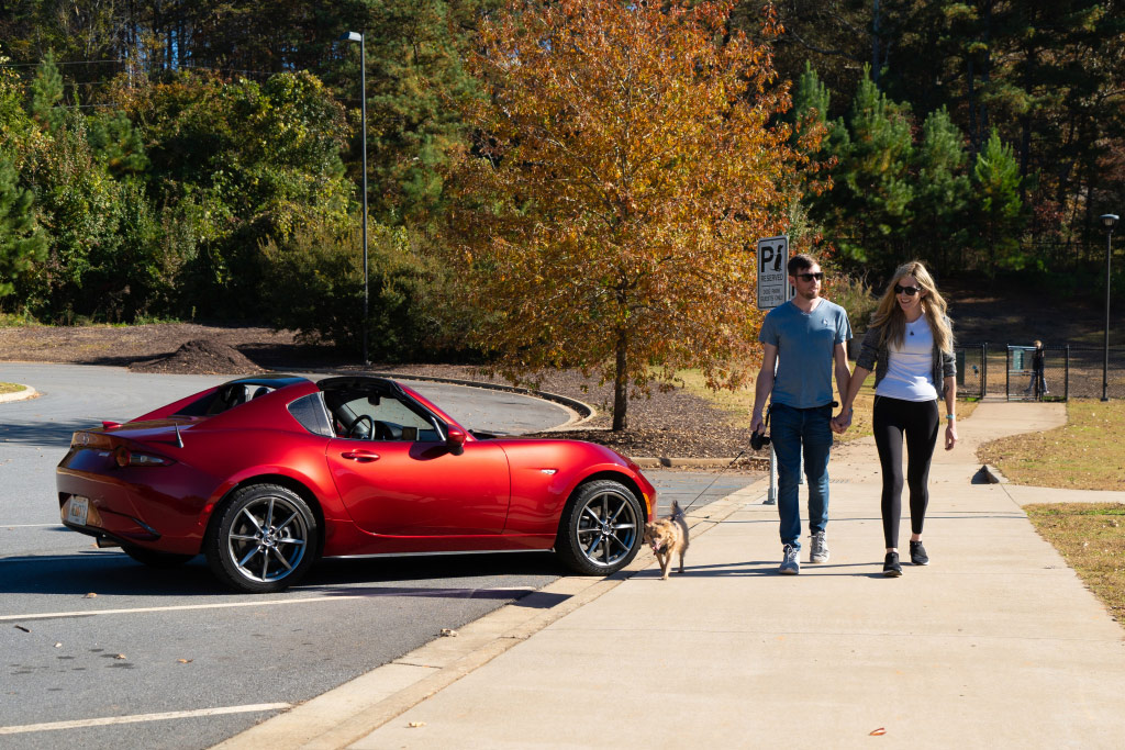 Melanie Wheeler With Fiancé Walking by Mazda MX-5 Miata