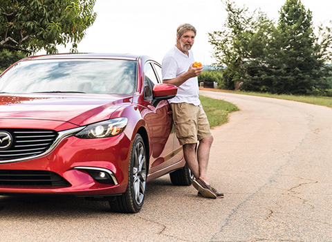 The Statesman Standing by a Mazda 6