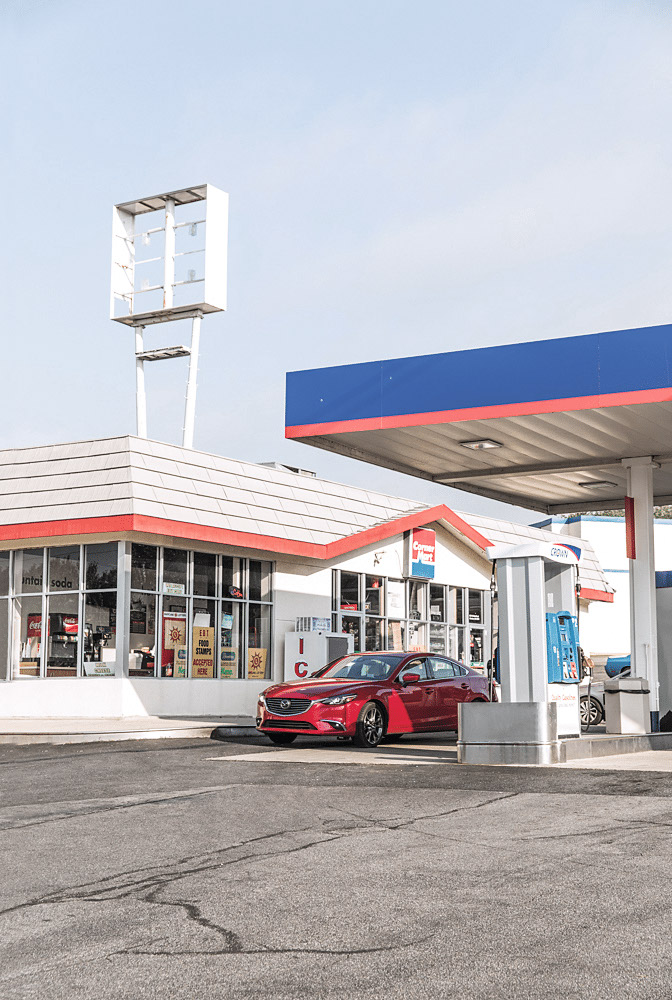 The Statesman – Mazda 6 at Gas Station