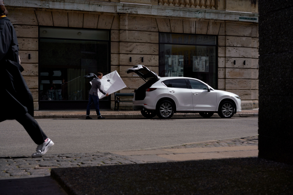 White Mazda CX-5 Crossover SUV with Open Trunk