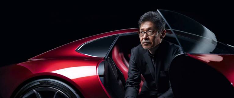 Mazda Design Chief Ikuo Maeda sitting in the RX-Vision sports car concept