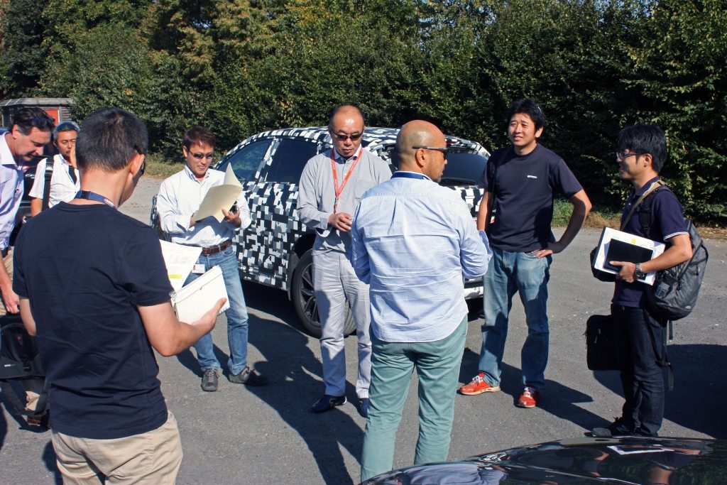 Kiyoshi Hayashi with Engineers by the Mazda CX-5 Prototype