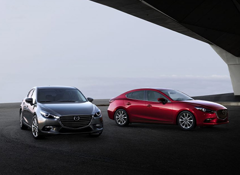 2 Parked Mazda 3 Vehicles