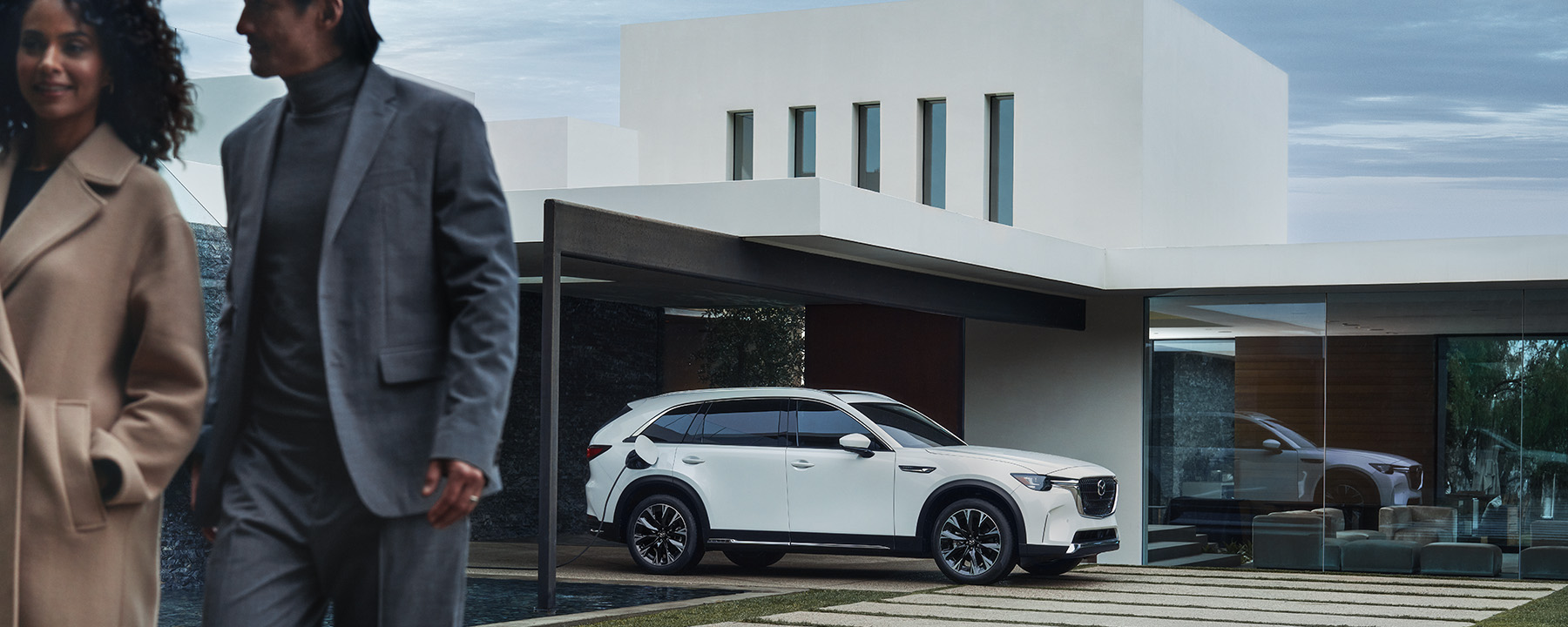 Electric Car Maintenance 101 – Mazda CX-90 PHEV Parked Outside House
